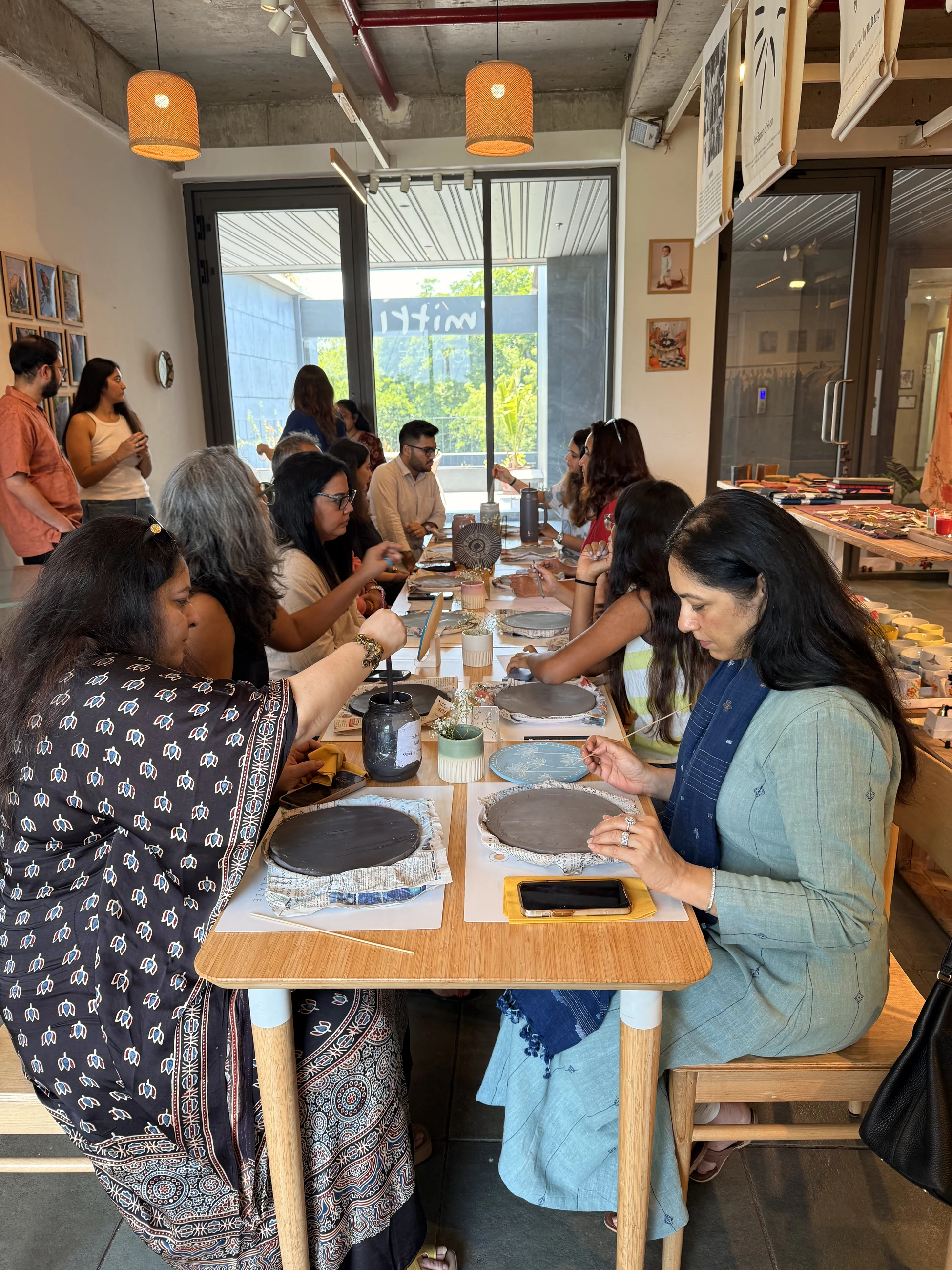 People working together around a Mitti workshop table