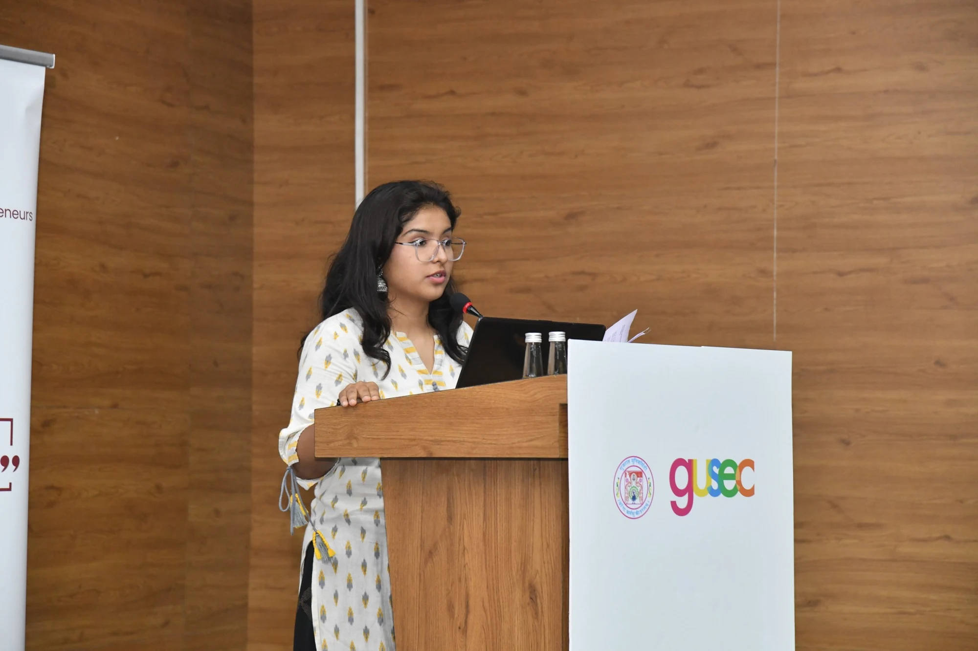 Ishika hosting at the GUSEC lectern