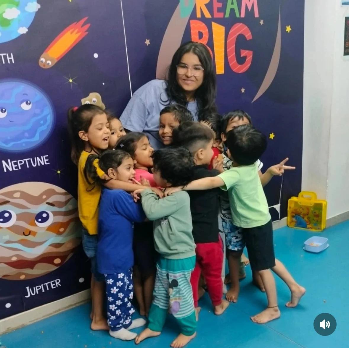 Ishika with children in the classroom